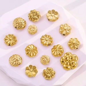 Golden stainless steel flower spacers and beads in various sizes for DIY jewelry making