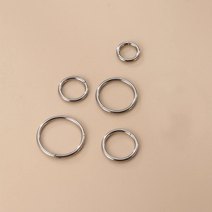 Five assorted sizes of polished G23 titanium seamless rings for nose, lip and ear piercing