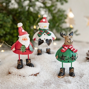Christmas iron ornaments featuring Santa, Snowman, and Reindeer on snowy background