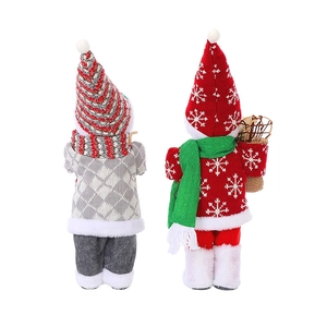 Detailed back view of plush Santa and snowman dolls with knitted textures and festive details