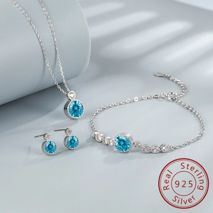 Detailed set of 925 silver jewelry featuring blue zircon necklace, bracelet and earrings