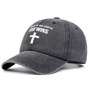 Washed dark grey baseball cap with white cross and God Wins text at 45-degree angle
