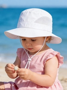 Detail of white kids sun hat with breathable mesh vents and adjustable chin strap