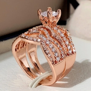 Macro detail of rose gold engagement ring set with brilliant cut cubic zirconia stones