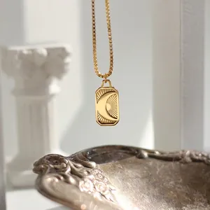 18K gold plated celestial necklace featuring a crescent moon and sunray coin pendant