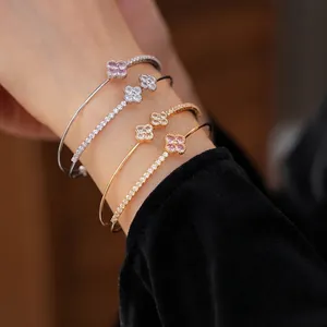 Double-layer four-leaf clover zircon open bangle in silver and gold finishes