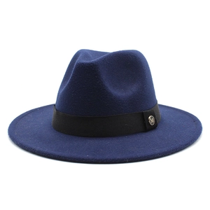 Detail of navy wool fedora with black ribbon band and golden metal M letter buckle