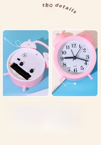 Detail of cute pink alarm clock showing the battery compartment and bell design