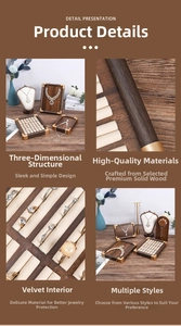 Detailed view of walnut wood jewelry display set with beige velvet lining and metal corners