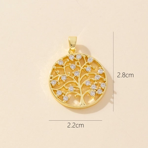 Detail shot of golden Tree of Life pendant with zircons and 2.2cm x 2.8cm dimensions