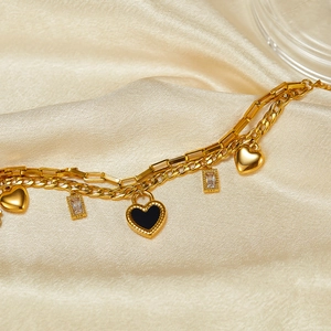 Double-layered gold stainless steel heart bracelet with black shell pendant on silk