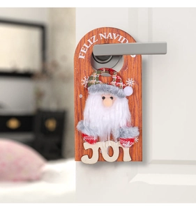 Detail of wooden Santa door hanger with Feliz Navidad text on a white handle