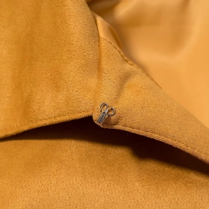 British style yellow suede poncho jacket with metallic hook clasp and fringe details