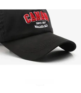 Close-up of CANADA letter embroidery on washed cotton baseball cap with twill texture