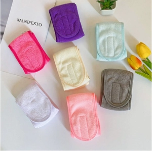 Close-up of soft coral fleece yoga headbands and wristbands set in assorted pastel colors