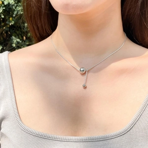 Minimalist 925 sterling silver necklace with geometric round bead pendant on model