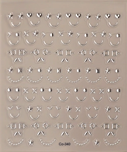 Close-up of metallic silver nail stickers featuring heart and star smiley face patterns