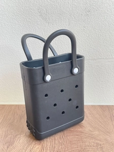 Detail shot of the breathable perforated EVA beach tote bag in classic black