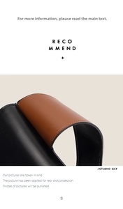 Detail view of high-quality stitching on black and brown leather contrast handbag