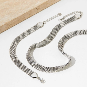 Silver wide mesh link necklace set with adjustable lobster clasp on white background