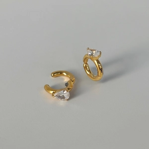 Golden titanium steel ear clips with pear-cut zircon stones in a retro vintage style