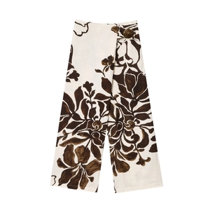 Women's two-piece floral print outfit featuring white and brown wide-leg pants with metal buckle