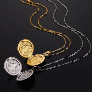 Religious Saint Benedict locket necklaces in gold and silver finish on black background