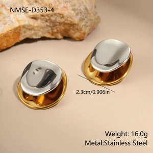 Detailed view of two-tone stainless steel geometric earrings with polished wavy design