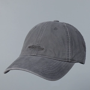 Macro detail of the 2025 dark grey baseball cap with NABENARA logo embroidery