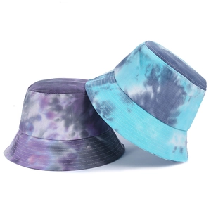 Close-up of tie-dye bucket hats showing durable cotton texture and precision stitching