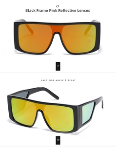 Detail view of large square sunglasses with black frames and pink reflective lenses