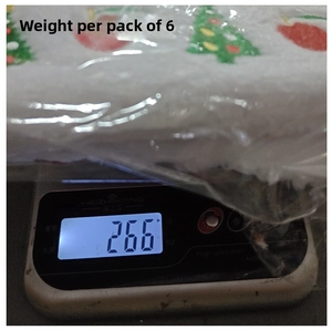 Weight measurement of a 6-pack Christmas hats set on a digital scale showing 266g