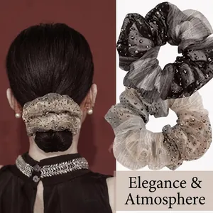 Detail of mesh ribbon hair scrunchie with delicate beads and elegant pleated texture