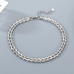 Detailed shot of silver geometric chain links with adjustable extender and lobster clasp