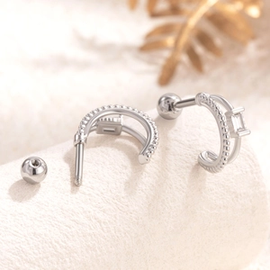 Silver double-layer curved stud earrings with cubic zirconia and screw ball backs