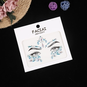 Detail of blue and aurora face gems and rhinestone stickers for makeup decoration