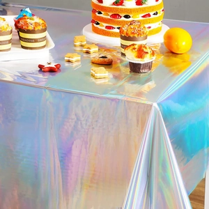 Close-up of laser rainbow party tablecloth showing iridescent reflection and waterproof texture