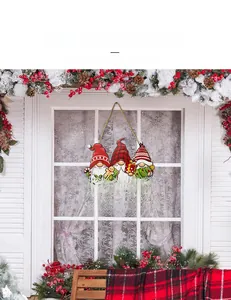 Detail of Christmas wooden Welcome sign with gnomes and red buffalo plaid pattern