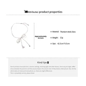 Detail showing titanium steel bow necklace with pink glass beads and product specifications