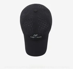 Top view of black mesh baseball cap showing laser-cut ventilation holes and brand logo