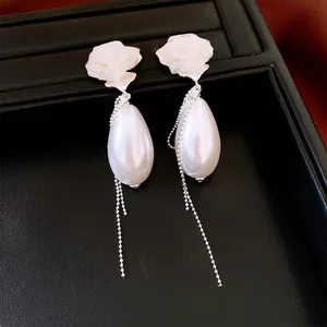 French palace style rose pearl tassel earrings with elegant white fabric flowers