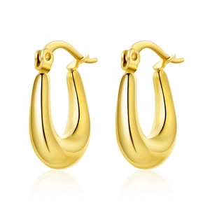 Close-up of chunky U-shaped gold hoop earrings with mirror polished finish and latch back