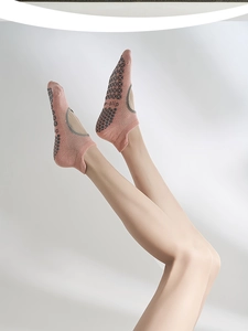 Detail of pink cotton yoga socks showing anti-slip sole texture and backless design