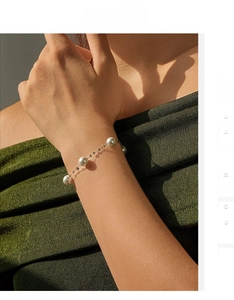 Elegant S925 silver pearl bracelet on wrist with glossy sequins and French style