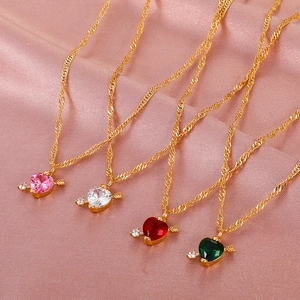 Detail view of four colorful heart pendants with Cupid's arrow design on pink silk