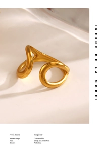 Detailed macro view of minimalist hollow gold water drop ring with a polished open design