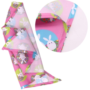 Pink Easter dog bandana featuring cartoon rabbits and floral eggs with reinforced stitching