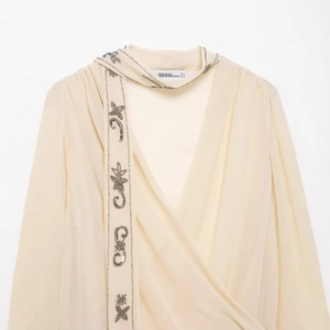 Elegant off-white chiffon long sleeve blouse with beaded embroidery and pleated neck