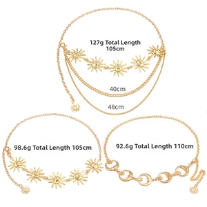 Detailed view of sun and moon gold layered waist chains with adjustable lobster clasps