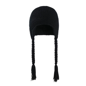 Detail of black knit baby hat with long handmade braided tassels and warm fuzzy lining
